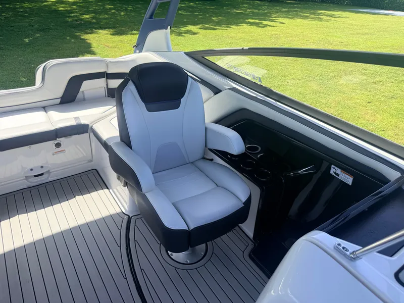 Slide: The Image of A modern boat seat with gray and black upholstery on a well-maintained deck. - 11