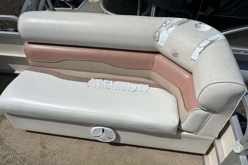 Slide: The Image of Worn 2001 SMOKERCRAFT boat seat with duct tape repairs and integrated speaker. - 5