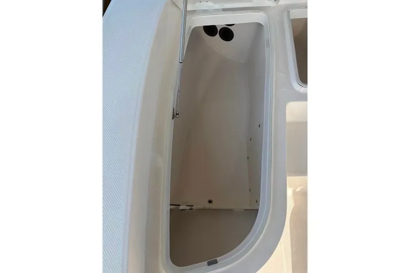Slide: The Image of Open storage compartment on a 2014 Robalo 206 Cayman boat. - 17