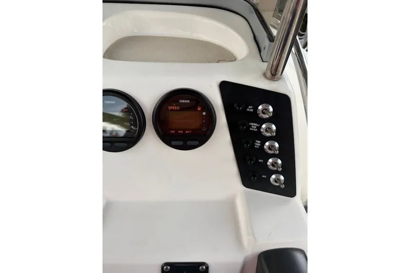 Slide: The Image of Dashboard of a 2014 Robalo 206 Cayman boat with Yamaha gauges and switches. - 15