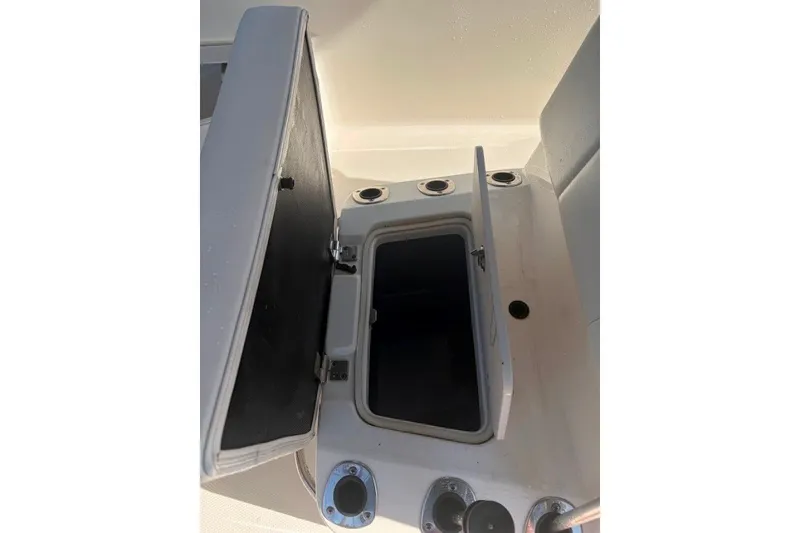 Slide: The Image of Open storage compartment on a 2014 Robalo 206 Cayman boat. - 16