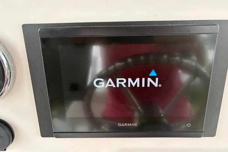Slide: The Image of Garmin display on 2014 Robalo 206 Cayman boat dashboard. - 13