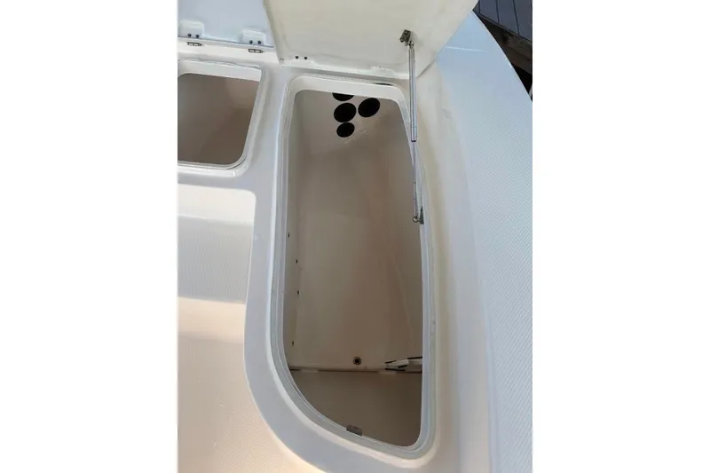 Slide: The Image of Open storage compartment on a 2014 Robalo 206 Cayman boat. - 19