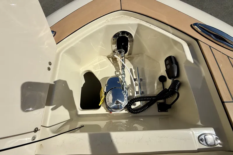 Slide: The Image of An anchor locker on a Chris-Craft Sportster 28 OB boat with windlass and controls. - 6