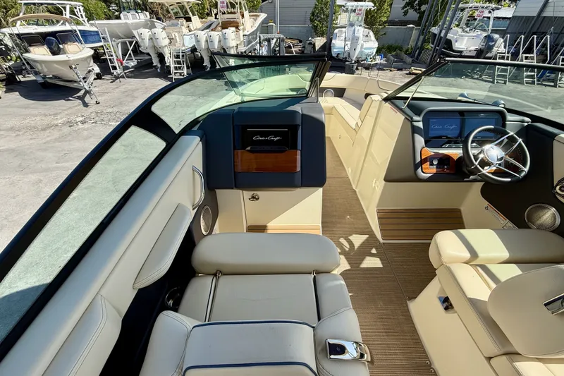 Slide: The Image of 2026 Chris-Craft Sportster 28 OB interior with luxurious seating and modern dashboard design. - 2