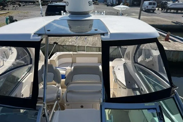 Slide: The Image of 2015 Chaparral 310 Signature boat interior with seating and navigation equipment. - 33