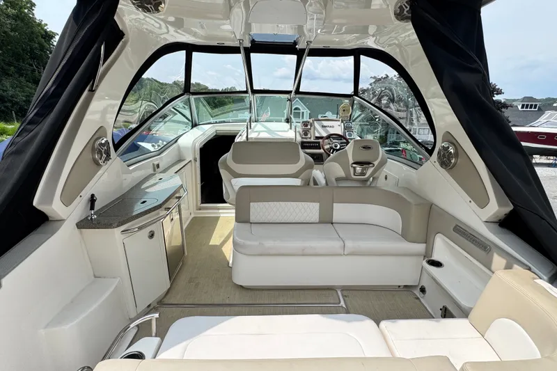 Slide: The Image of Interior of 2015 Chaparral 310 Signature boat with seating and helm station. - 5
