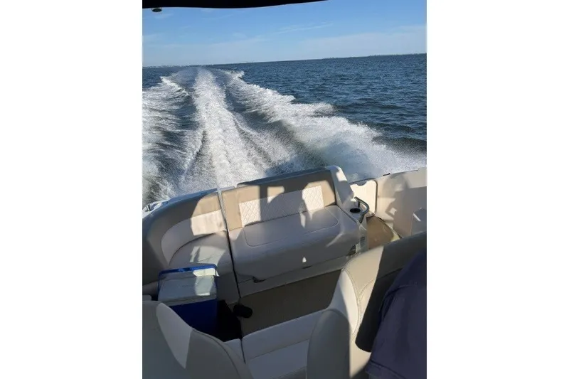 Slide: The Image of 2015 Chaparral 310 Signature cruising on open water, leaving a wake behind. - 34