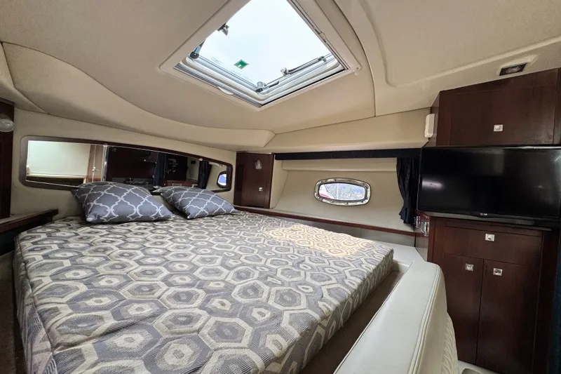 Slide: The Image of Luxurious interior of 2015 Chaparral 310 Signature yacht with cozy bed and modern amenities. - 19