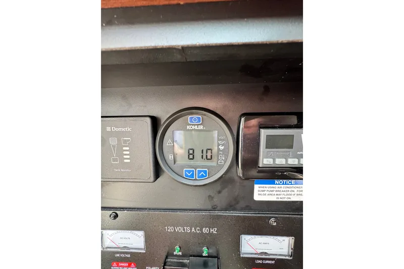 Slide: The Image of Control panel of a 2015 Chaparral 310 Signature boat, featuring Kohler display. - 30