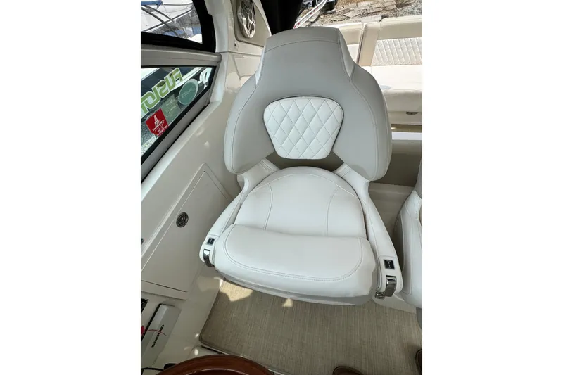 Slide: The Image of Luxurious white seat in 2015 Chaparral 310 Signature boat interior. - 9