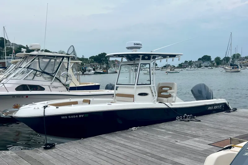 Slide: The Image of 2021 Release 240 RX boat docked at marina, featuring sleek design and modern equipment. - 4