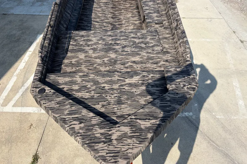 Slide: The Image of 2026 Havoc 1756 MSTC boat with camouflage pattern on concrete surface. - 5