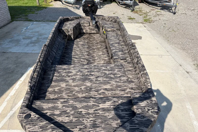 Slide: The Image of 2026 Havoc 1756 MSTC boat with camouflage interior, parked on concrete. - 6