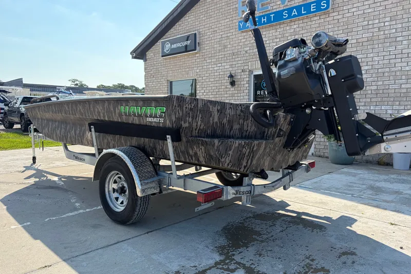 Slide: The Image of 2026 Havoc 1756 MSTC boat on trailer at yacht sales dealership. - 2