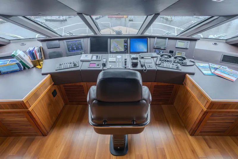 Slide: The Image of Luxurious Sunseeker 131 Yacht 2014 helm with advanced navigation controls and panoramic view. - 49