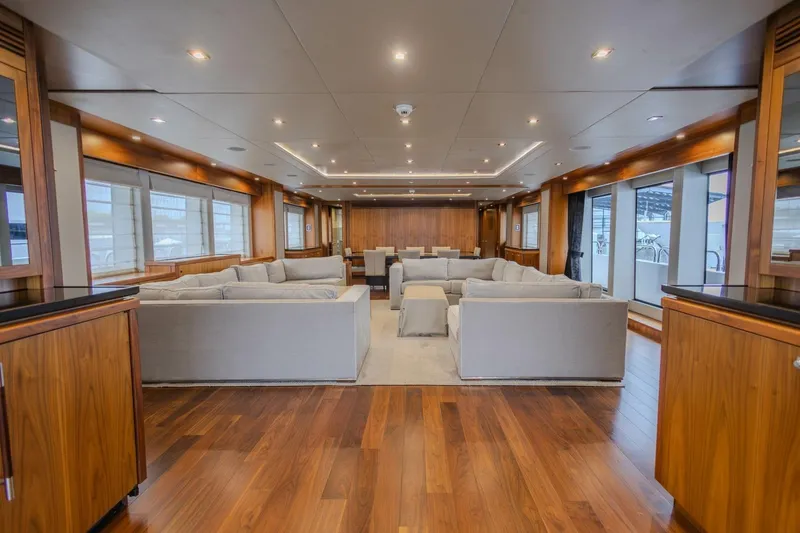 Slide: The Image of Luxurious interior of 2014 Sunseeker 131 Yacht with elegant wood flooring and plush seating. - 56
