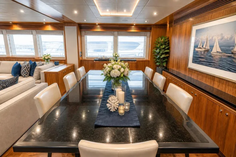 Slide: The Image of Luxurious dining area on 2014 Sunseeker 131 Yacht with elegant decor and large windows. - 8