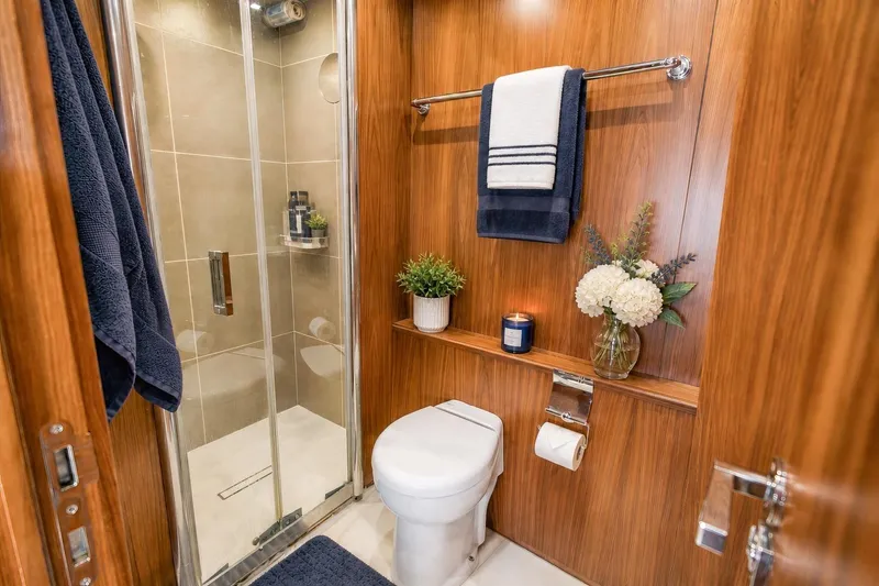 Slide: The Image of Luxurious Sunseeker 131 Yacht 2014 bathroom with wood paneling, shower, and elegant decor. - 45