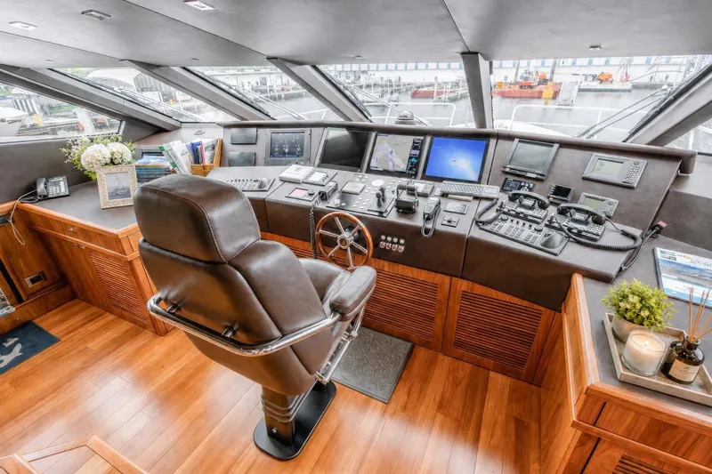 Slide: The Image of Luxurious helm of 2014 Sunseeker 131 Yacht with advanced navigation equipment and leather captain's chair. - 22