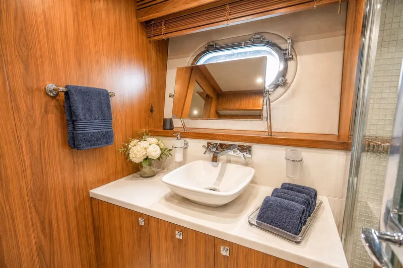 Slide: The Image of Luxurious bathroom on 2014 Sunseeker 131 Yacht with elegant wood paneling and modern fixtures. - 33