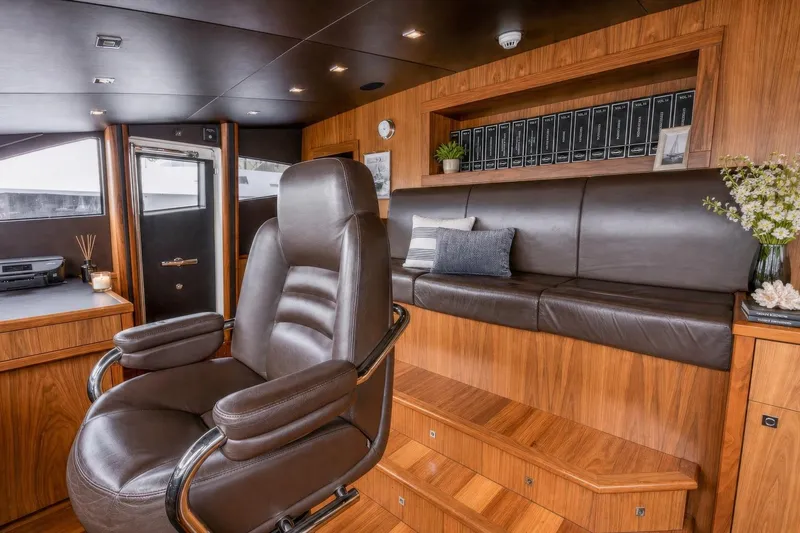 Slide: The Image of Luxurious interior of 2014 Sunseeker 131 Yacht with leather seating and wooden accents. - 23