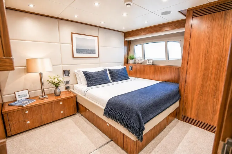 Slide: The Image of Luxurious bedroom interior on 2014 Sunseeker 131 Yacht, featuring elegant wood finishes and cozy bedding. - 30