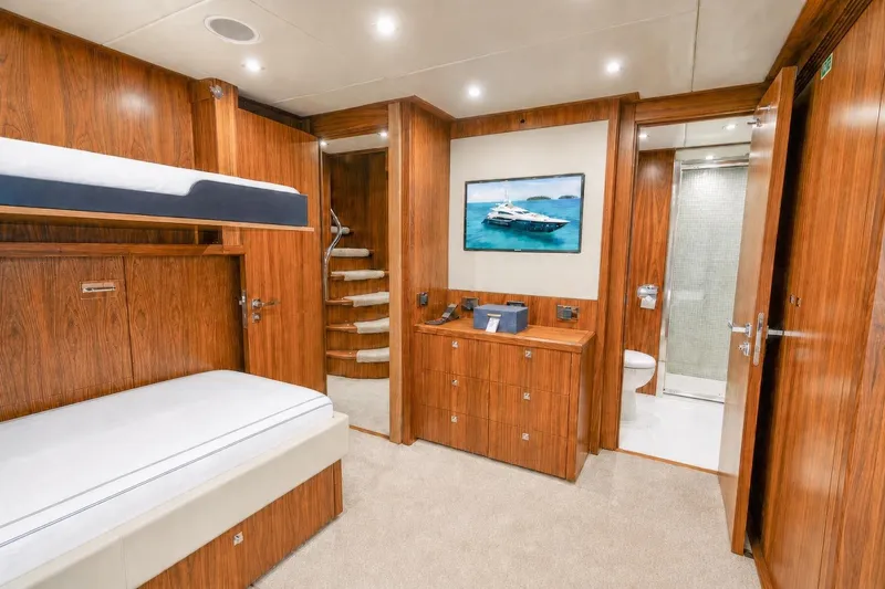 Slide: The Image of Luxurious Sunseeker 131 Yacht 2014 cabin with wooden interior and modern amenities. - 44