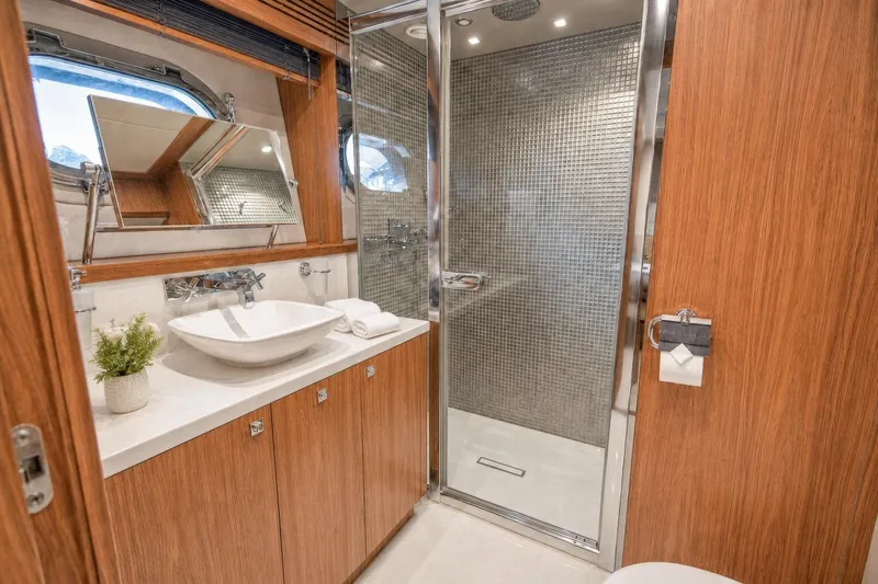 Slide: The Image of Luxurious bathroom on 2014 Sunseeker 131 Yacht with modern fixtures and elegant wood finishes. - 32