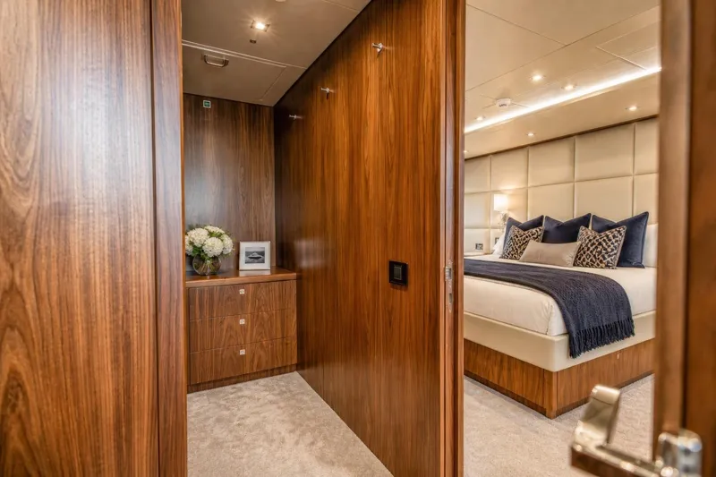 Slide: The Image of Luxurious Sunseeker 131 Yacht bedroom with elegant wood paneling and plush bedding, 2014 model. - 17
