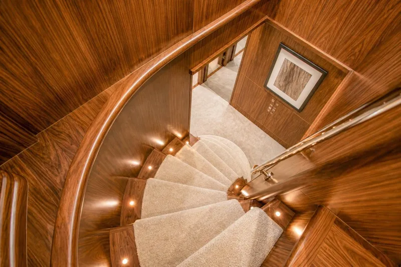 Slide: The Image of Luxurious wooden staircase with carpeted steps on a 2014 Sunseeker 131 Yacht. - 29