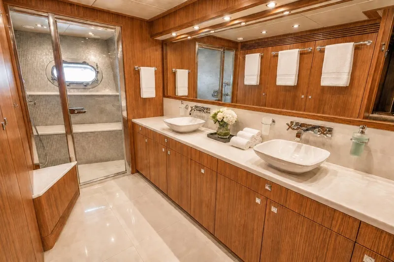 Slide: The Image of Luxurious bathroom on 2014 Sunseeker 131 Yacht with dual sinks and elegant wood cabinetry. - 15