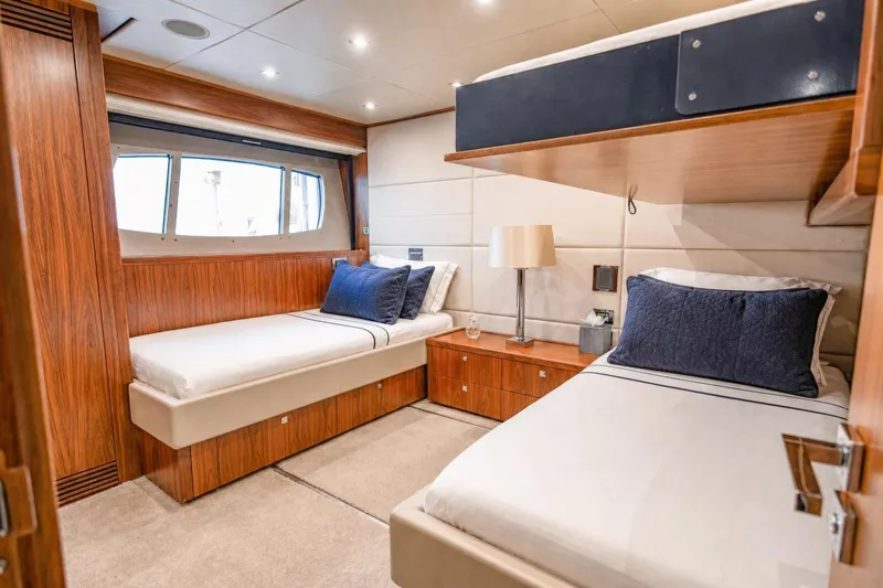 Slide: The Image of Luxurious twin cabin interior on 2014 Sunseeker 131 Yacht, featuring elegant wood finishes. - 43