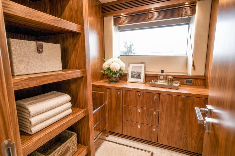 Slide: The Image of Luxurious wooden interior of 2014 Sunseeker 131 Yacht with elegant storage and decor. - 18