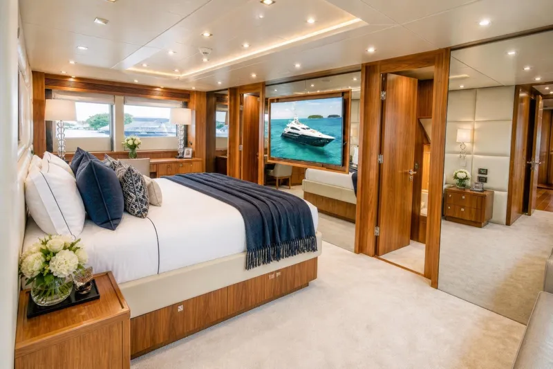 Slide: The Image of Luxurious Sunseeker 131 Yacht 2014 bedroom with elegant wood finishes and plush bedding. - 11