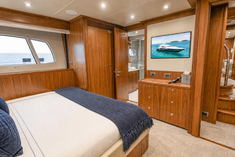 Slide: The Image of Luxurious Sunseeker 131 Yacht 2014 bedroom interior with wood paneling and ocean view. - 31