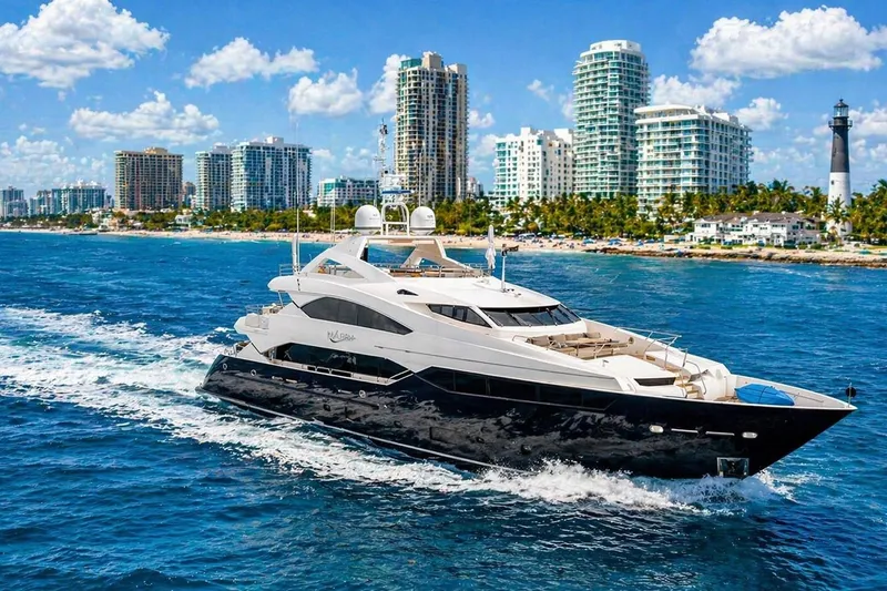 Slide: The Image of Luxurious 2014 Sunseeker 131 Yacht cruising near a coastal city skyline. - 2