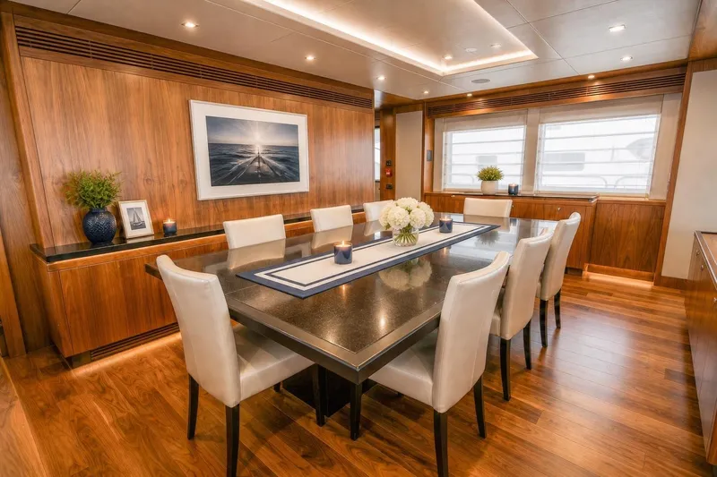 Slide: The Image of Luxurious dining area on 2014 Sunseeker 131 Yacht with elegant decor and wooden accents. - 7
