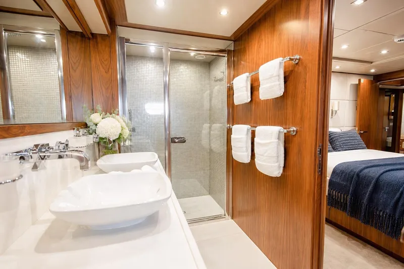 Slide: The Image of Luxurious bathroom on 2014 Sunseeker 131 Yacht with dual sinks and elegant wood finishes. - 36