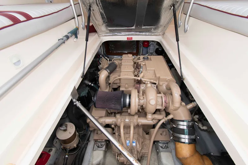 Slide: The Image of Engine compartment of a 2001 Mainship Pilot 30 boat, showcasing detailed mechanical components. - 20