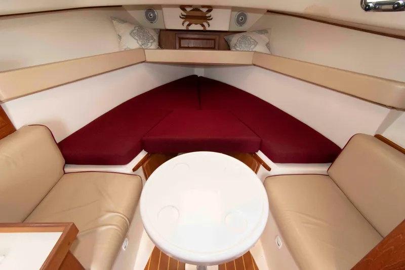 Slide: The Image of Interior of 2001 Mainship Pilot 30 boat with seating and table. - 17