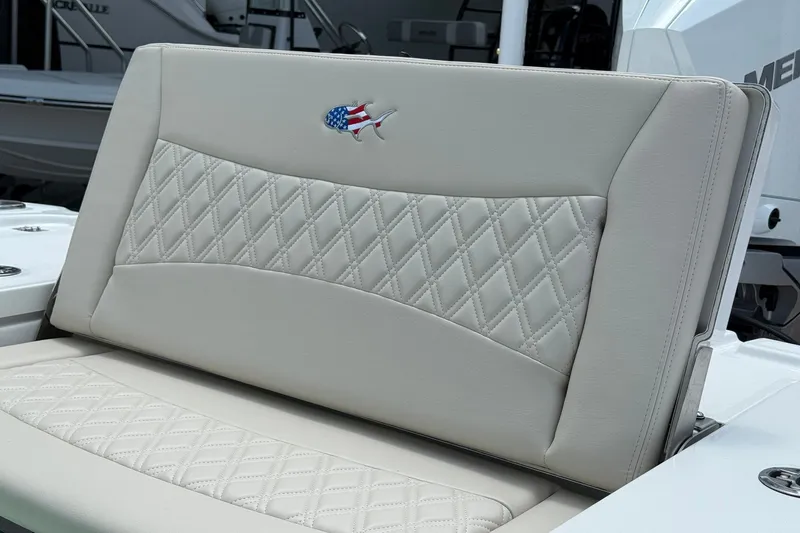 Slide: The Image of Luxurious seating on 2027 Crevalle 24 HCO boat with diamond stitching and fish emblem. - 6