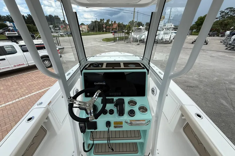 Slide: The Image of Interior view of 2027 Crevalle 24 HCO boat dashboard with Garmin navigation system. - 14