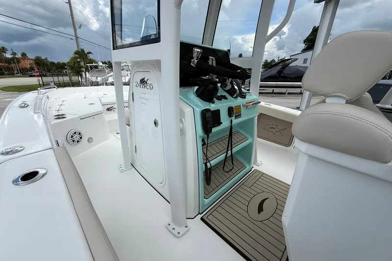 Slide: The Image of 2027 Crevalle 24 HCO boat interior with helm station and seating, showcasing modern design. - 11