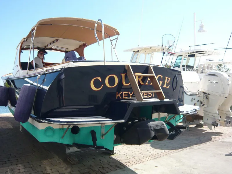 Slide: The Image of Hinckley 36 Classic 1998 boat named "Courage" docked in Key West marina. - 34