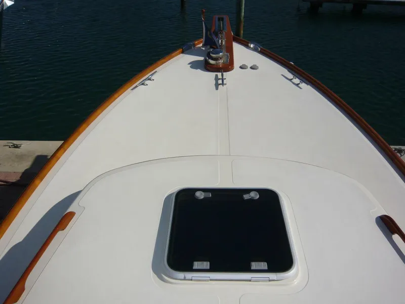 Slide: The Image of Bow view of 1998 Hinckley 36 Classic yacht with wooden trim and hatch. - 19