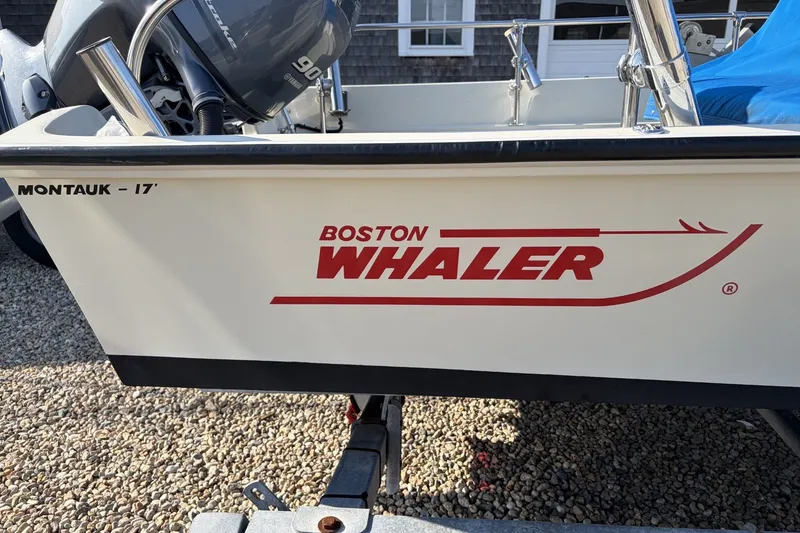Slide: The Image of 1985 Boston Whaler 17 Montauk boat with visible logo and Yamaha outboard motor. - 16