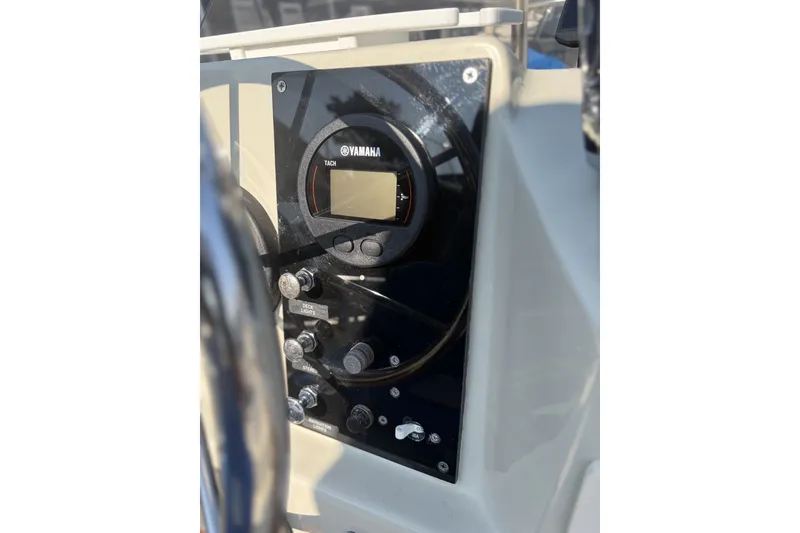 Slide: The Image of Control panel of a 1985 Boston Whaler 17 Montauk boat with Yamaha tachometer. - 13