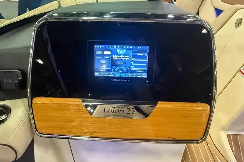 Slide: The Image of Dashboard of 2026 Chris-Craft Launch 27 boat with digital display and wood accents. - 5