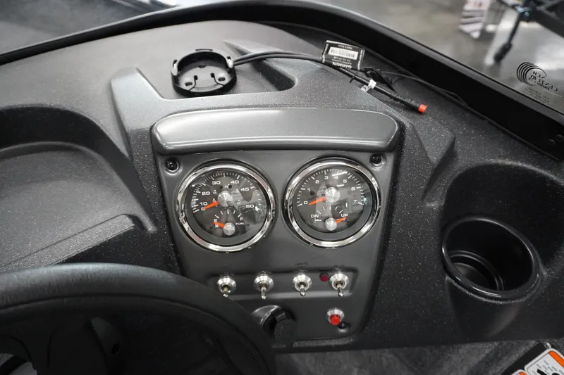 Slide: The Image of Dashboard of 2027 Tracker Pro Guide V-16 WT boat with gauges and controls. - 14